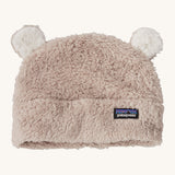 Patagonia little kids friends hat. A light grey furry beanie to keep the head warm which features white bear-like ears on the top of the beanie. Features the logo patch stitched on the front side of the hat.