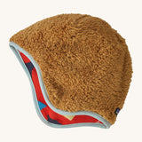 The reversible side of the Patagonia beanie showing the brown cosy fleece fur and light blue trim. Features the logo patch stitched on the back.