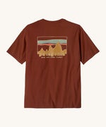 Patagonia Men's 73 Skyline Organic T-Shirt. A brown top with short sleeves with a brand logo in a sketch design printed on the back