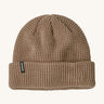 Patagonia adult snow drifter beanie in a pale khaki colour. A ribbed knitted style beanie with the logo branding on the side of the turn up brim.