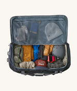 Patagonia 100 litres duffel bag in a navy blue colour fully packed and inside detail