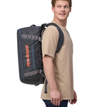 Patagonia 40 litres duffel bag in a dark navy blue colour carried by an adult.