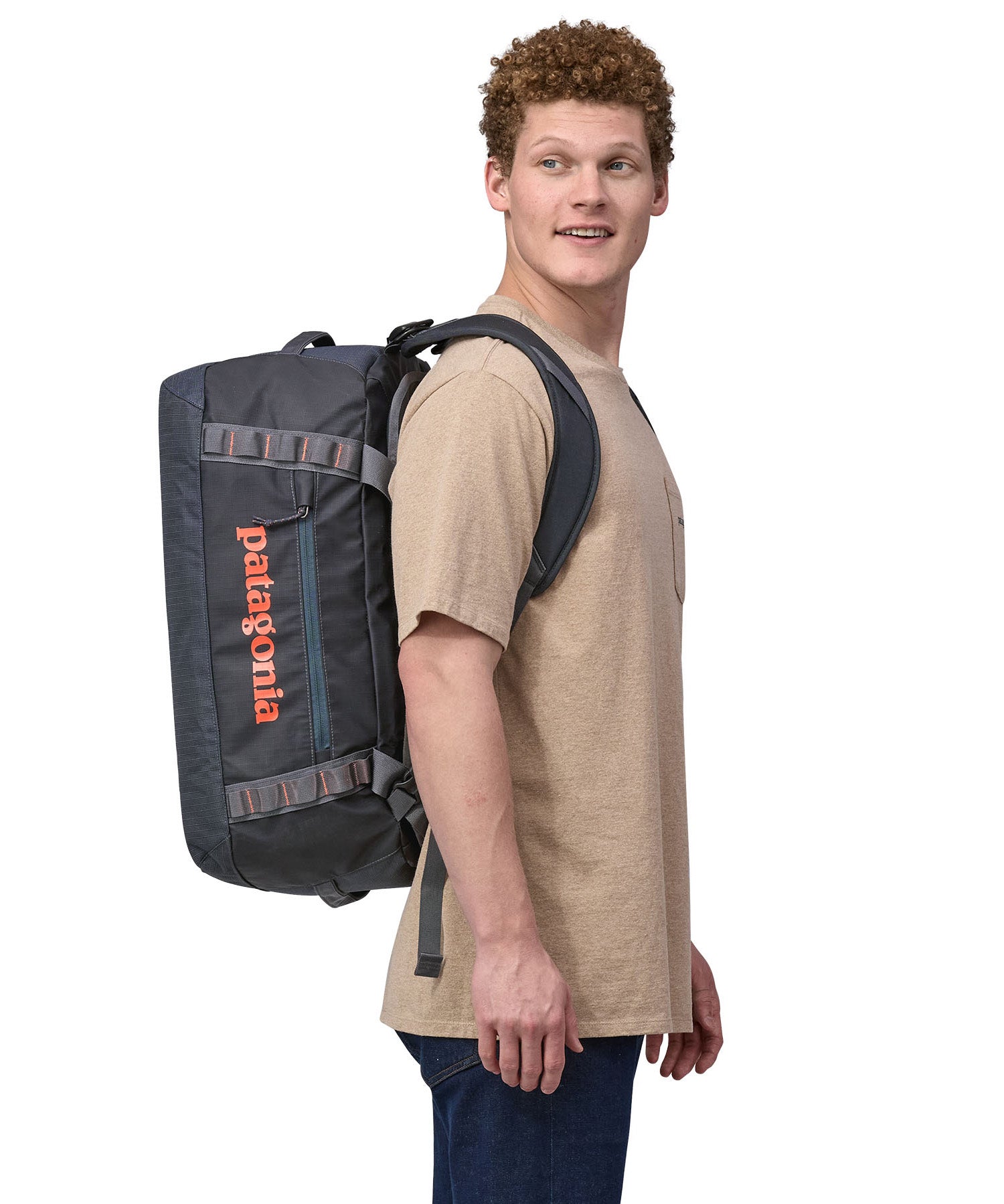Patagonia 40 litres duffel bag in a dark navy blue colour carried by an adult.