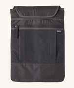 The laptop sleeve of the smolder blue Patagonia Refugio Day Pack 26L