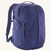 Patagonia purple 26L day refugio backpack on a cream background.