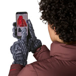 An adult using the phone while wearing the Patagonia adult synchilla gloves in sunken blue available at Babipur.