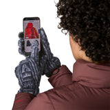An adult using the phone while wearing the Patagonia adult synchilla gloves in sunken blue available at Babipur.