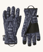 Patagonia adult synchilla gloves in sunken blue. Dark blue gloves with retro patterns, features a grip on the palms and fingertips. Logo label is stitched on the side . 