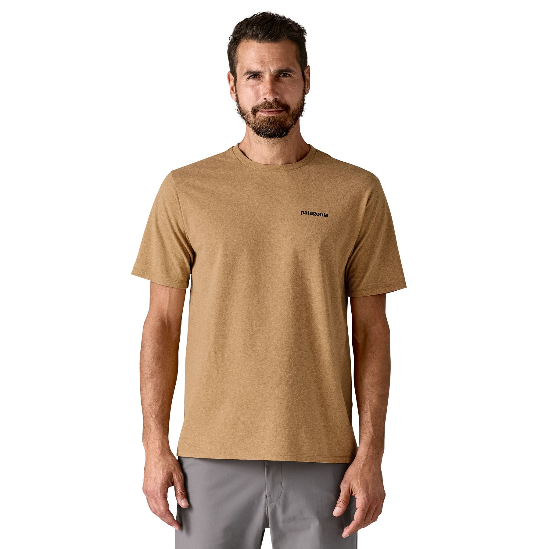 A man wearing the Patagonia men's logo responisbilli tee in talon gold available at Babipur.