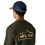 The back of a man wearing the Patagonia adult talon gold trucker hat available at Babipur
