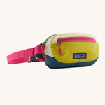 The Patagonia Terravia Mini Bum Bag, with yellow shades on the main pack and neon pink zippers and straps.