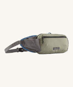 Patagonia terravia hip bag in a river rock green colour on a cream background.