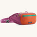 Patagonia terravia hip pack in bright purple with an orange front panel and quick release buckle closure and mesh side pockets