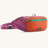 Patagonia terravia hip pack in bright purple with an orange front panel and quick release buckle closure and mesh side pockets