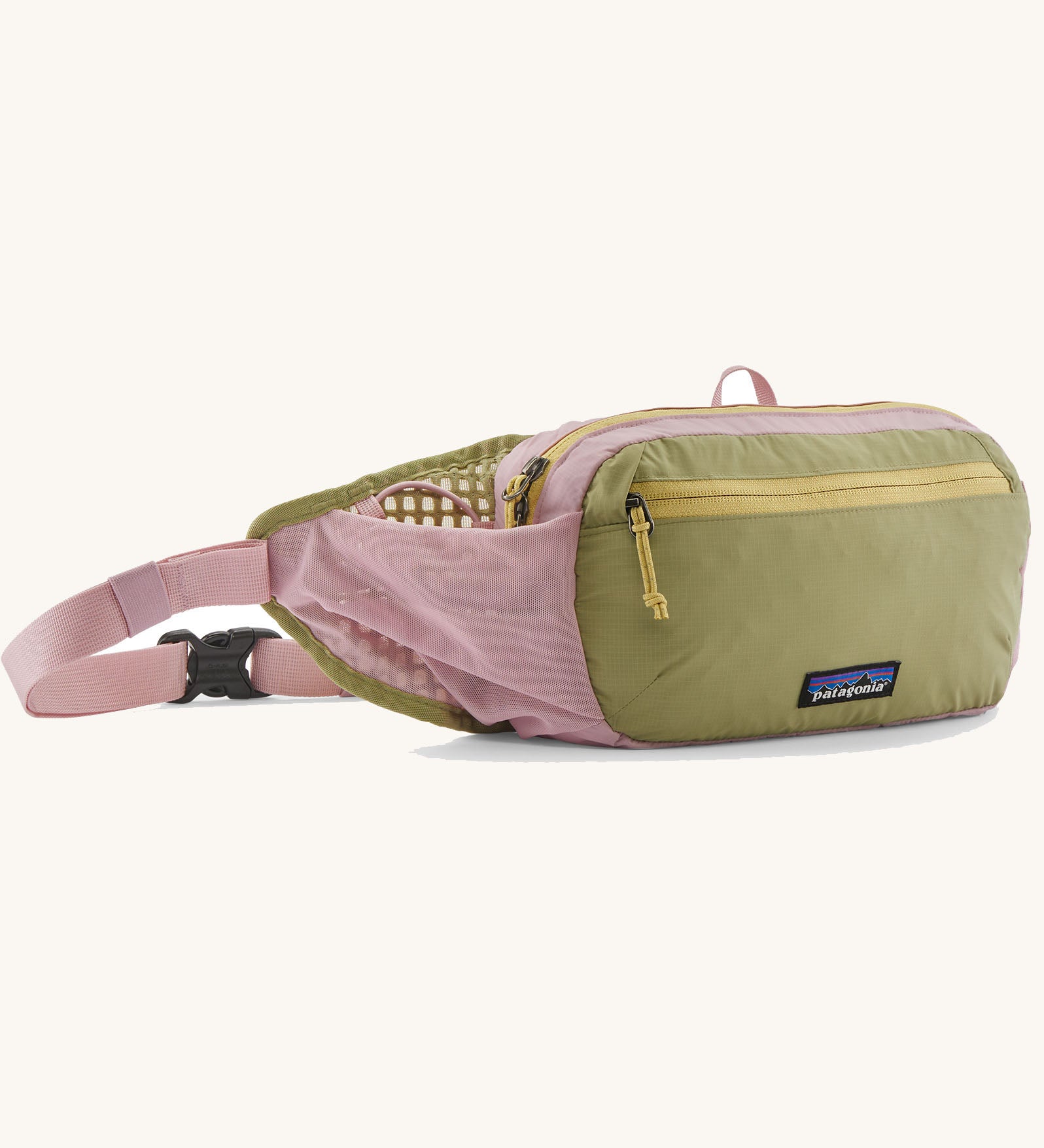 Patagonia terravia hip pack in quiet violet with a green front panel and a small black logo tag on the front. 