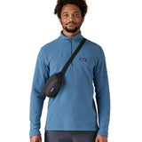 Man wearing the Patagonia Terravia Mini Bum Bag Hip Pack in a black over the shoulder 