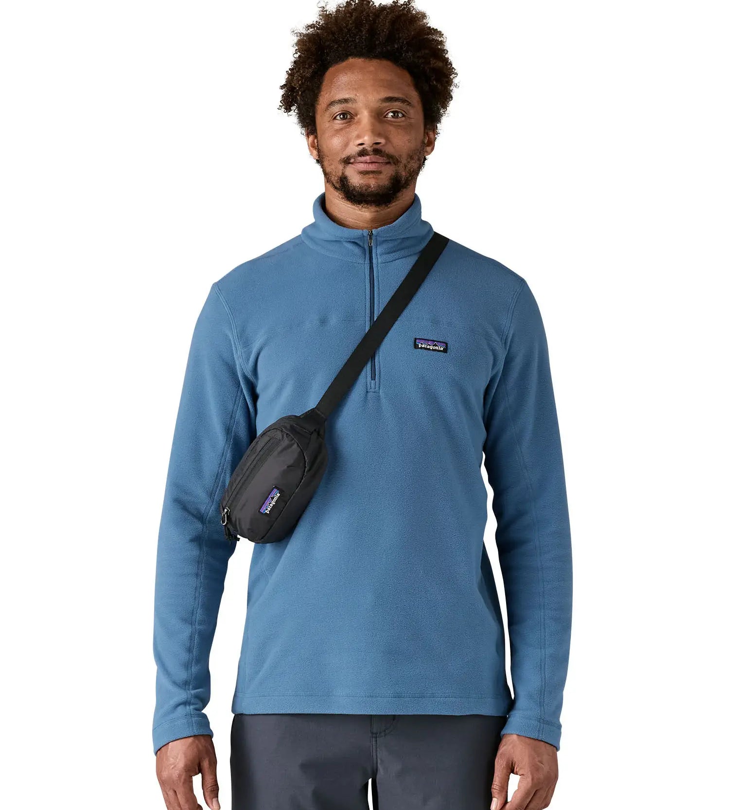 Man wearing the Patagonia Terravia Mini Bum Bag Hip Pack in a black over the shoulder 
