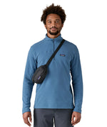 Man wearing the Patagonia Terravia Mini Bum Bag Hip Pack in a black over the shoulder 