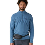 Man wearing the Patagonia Terravia Mini Bum Bag Hip Pack in a black around the waist.