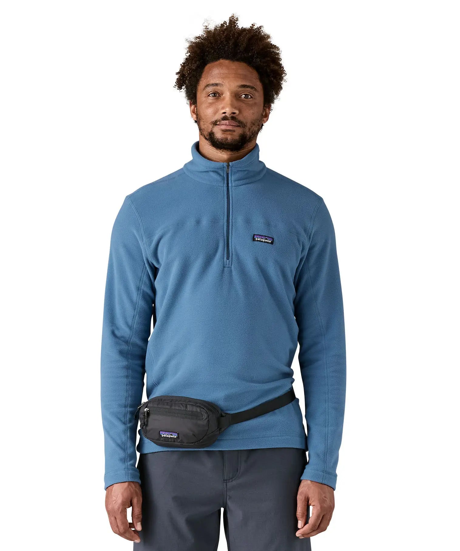Man wearing the Patagonia Terravia Mini Bum Bag Hip Pack in a black around the waist.