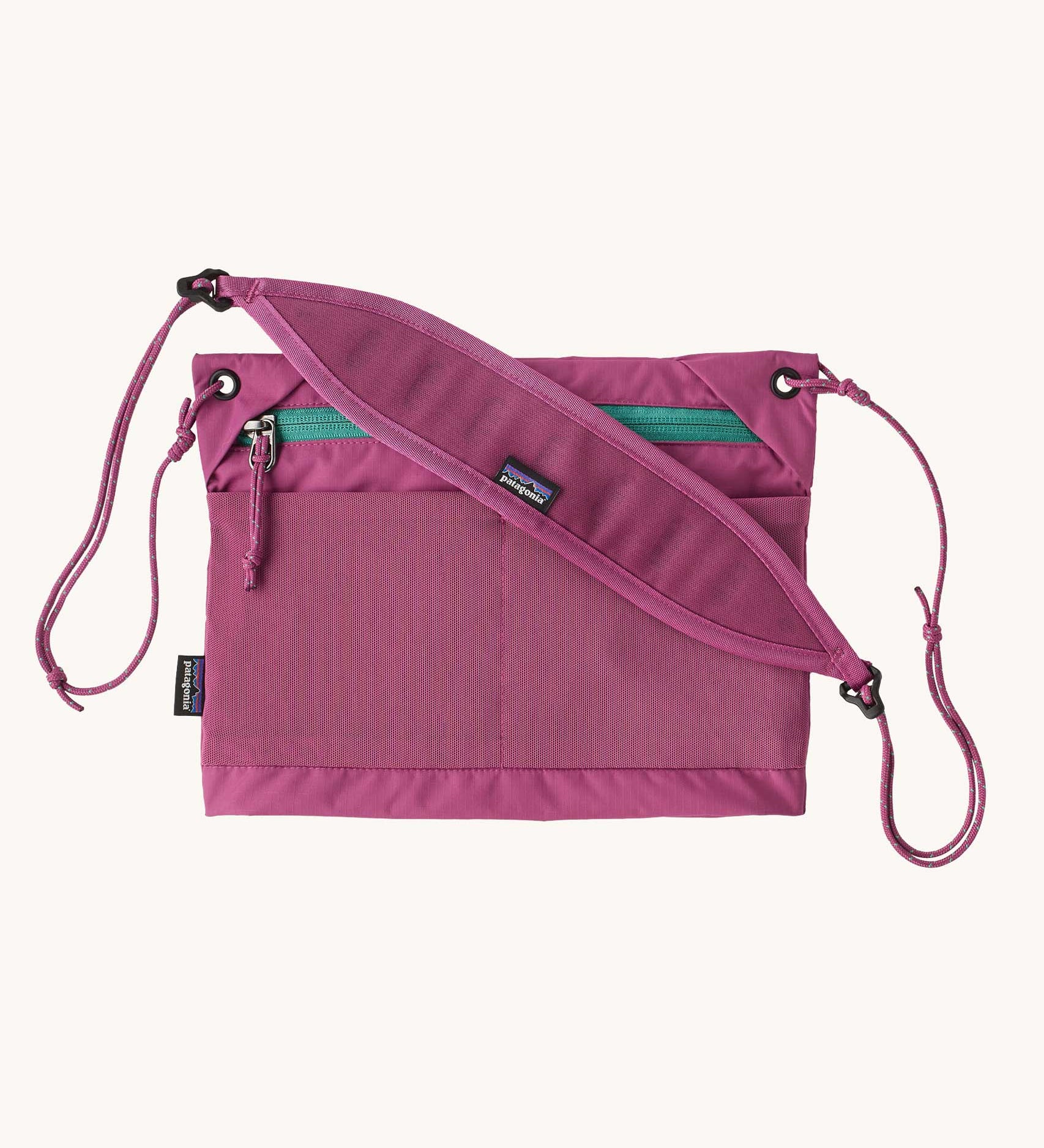 Patagonia terravia sacoche cross body bag in faded magenta with padded shoulder pad. 