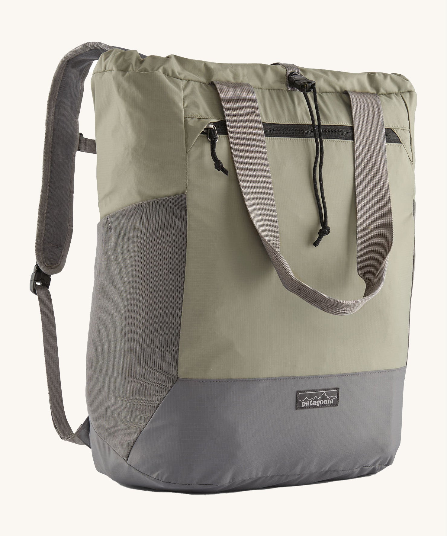 Patagonia Terravia tote bag in river rock green colour showing the front zip and strap details with the brand log on the bottom grey panel. Features shoulder straps for easy carrying 