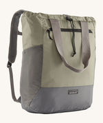 Patagonia Terravia tote bag in river rock green colour showing the front zip and strap details with the brand log on the bottom grey panel. Features shoulder straps for easy carrying 