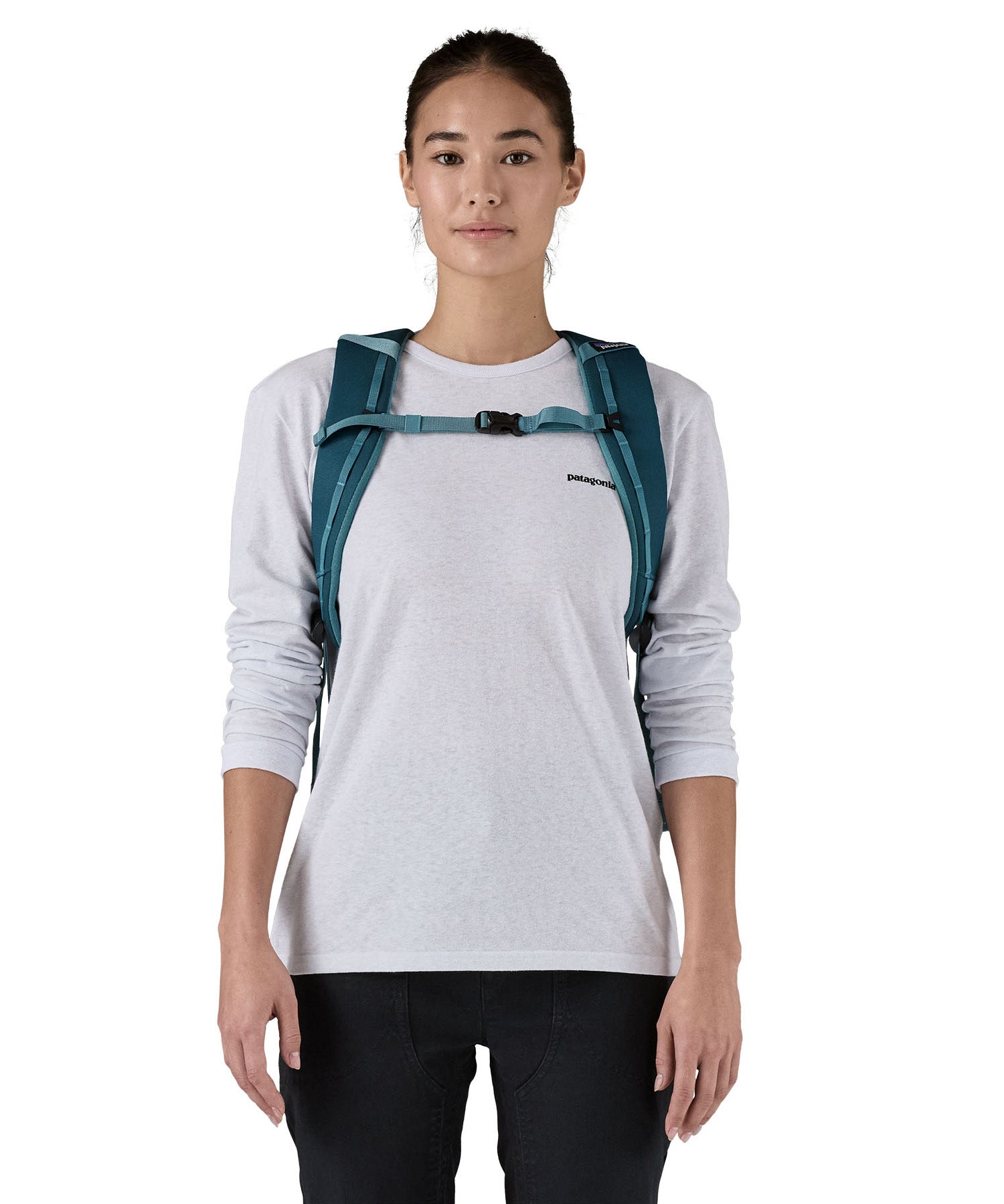 Patagonia 25L black hole backpack in a tidal teal colour shoulder strap and clip detail