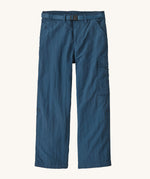 Patagonia kids everyday outdoor pants in a navy colour on a cream background.