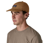 A man wearing the Patagonia adult cap in deer brown colour available at Babipur.