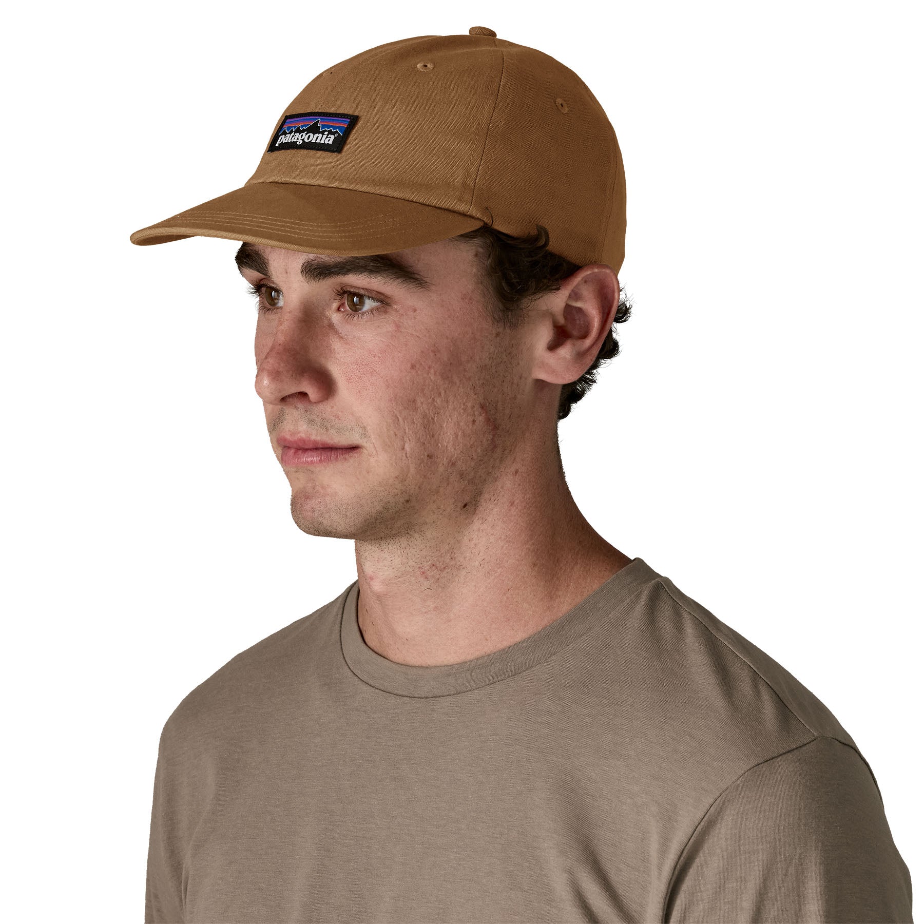 A man wearing the Patagonia adult cap in deer brown colour available at Babipur.