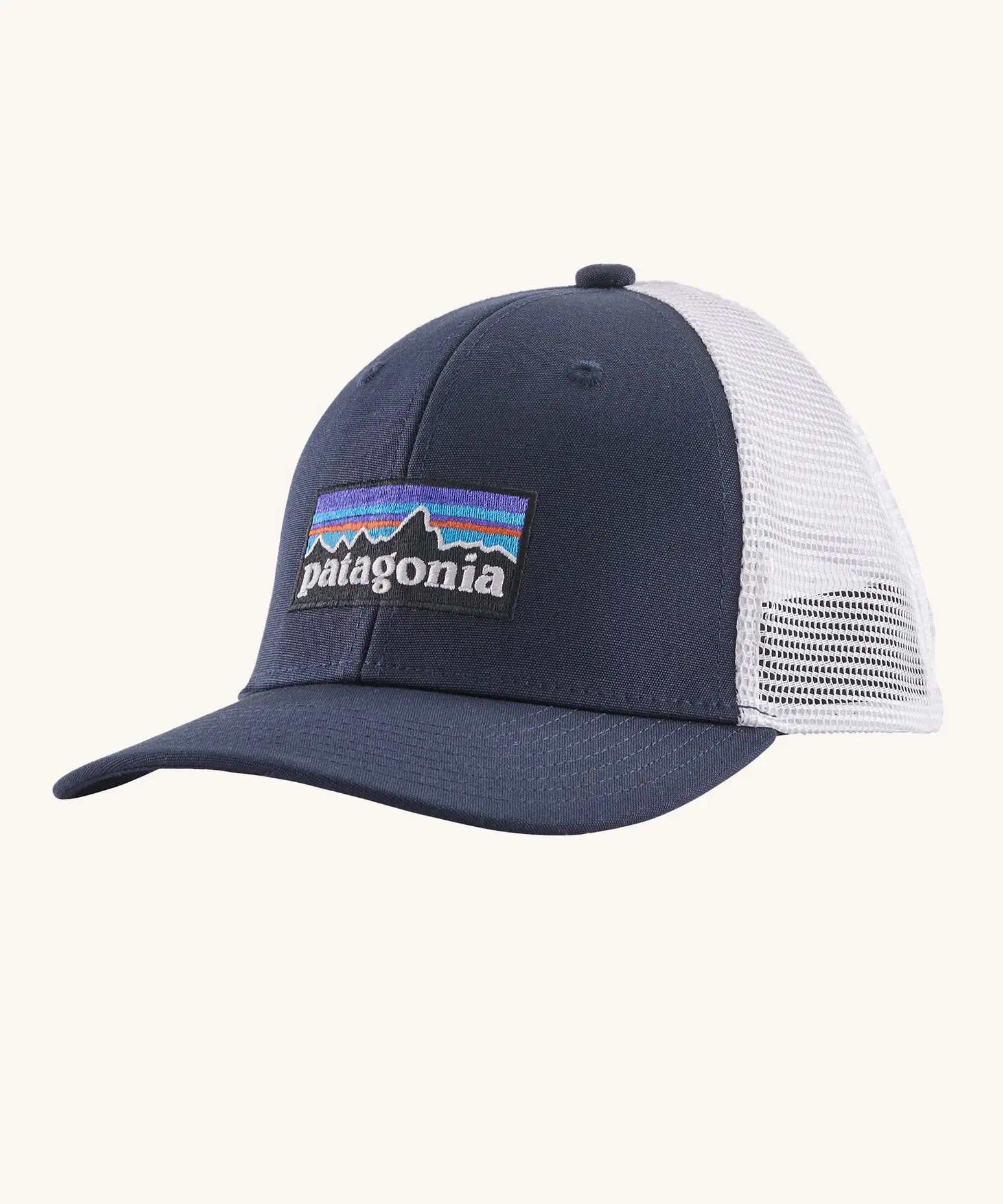 Patagonia Kids P6 logo baseball cap in navy with a white mesh back panel. Showing brand patch on the front