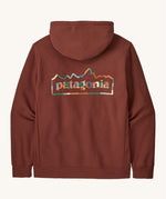 Rear view of the Patagonia unity Fitz mens hoodie in dark red showing the large logo print on the back filled in with block colours