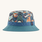 Patagonia wavefarer bucket hat in  blue and multicoloured geo design on a cream background.