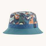 Patagonia wavefarer bucket hat in  blue and multicoloured geo design on a cream background.