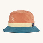 Patagonia wavefarer bucket hat in  blue yellow and orange block colour on a cream background.
