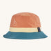 Patagonia wavefarer bucket hat in  blue yellow and orange block colour on a cream background.