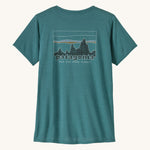 patagonia women's capilene top in a turquoise colour with logo design on a cream background.