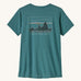 patagonia women's capilene top in a turquoise colour with logo design on a cream background.