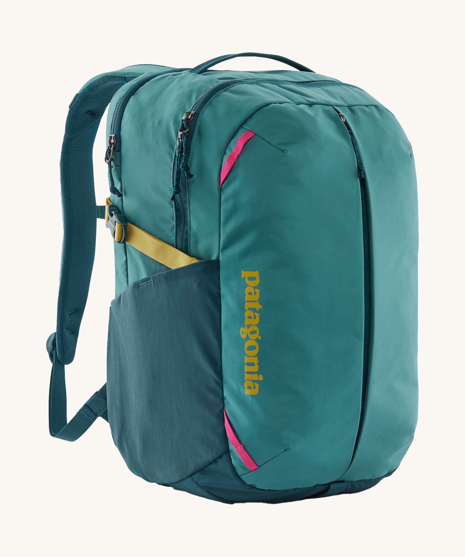 Patagonia turquoise 26L day refugio backpack on a cream background.