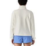 Back of woman wearing Patagonia women's microdini fleece in white. Fleece has a relaxed fit