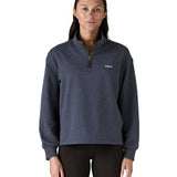 A woman wearing a dark grey blue coloured Patagonia Women's Ahnya Pullover.