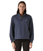 A woman wearing a dark grey blue coloured Patagonia Women's Ahnya Pullover.