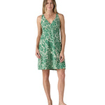 Model wearing the Patagonia organic  cotton knee-length dress with a green pattern.