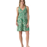 Model wearing the Patagonia organic  cotton knee-length dress with a green pattern.