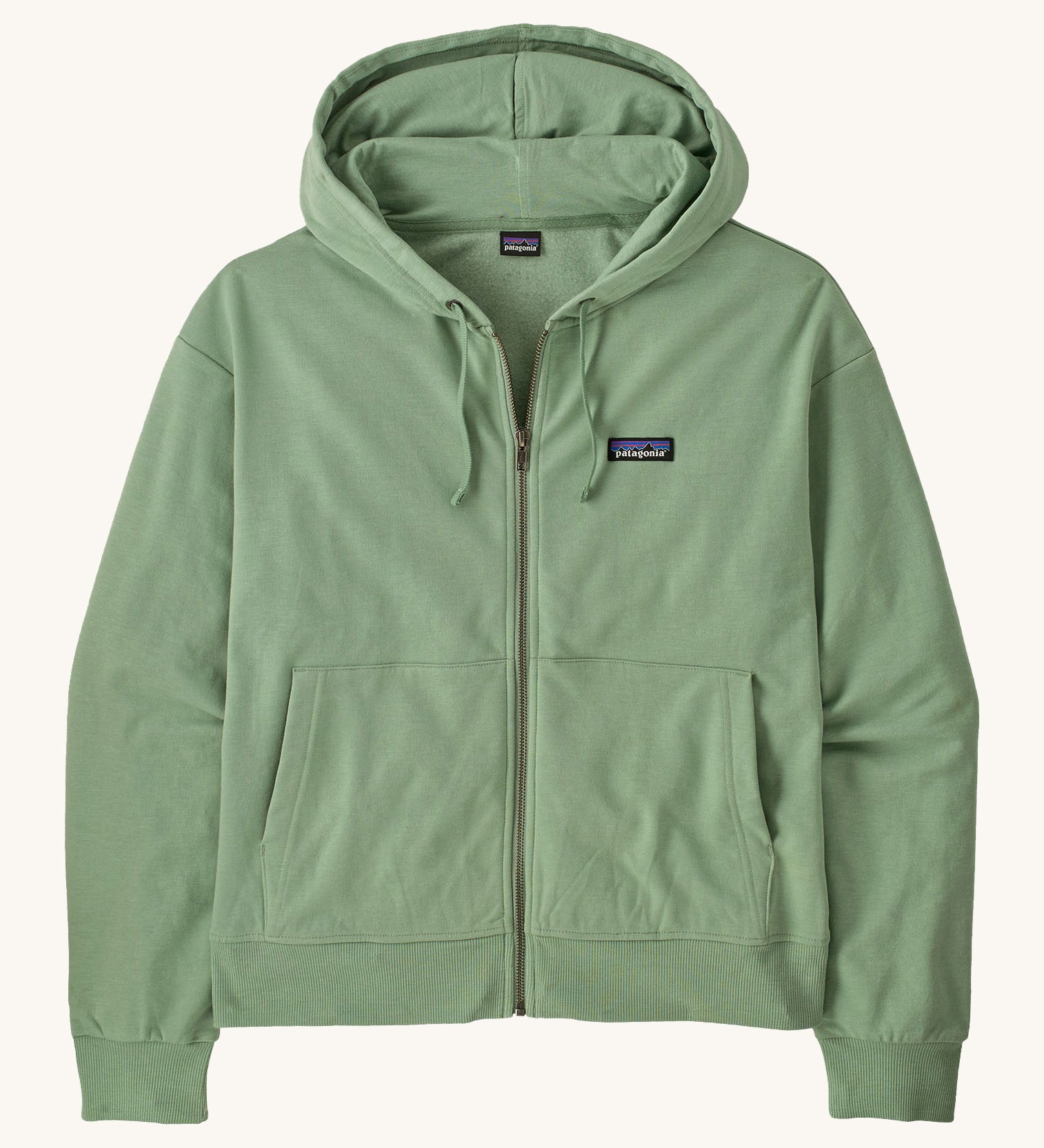 Patagonia women's Anhya hoody. A pastel green lightweight jacket available at Babipur. Features a full length zip, a logo patch stitched on the left chest, a easy access pockets and a drawstring around the hood for size adjustments.  