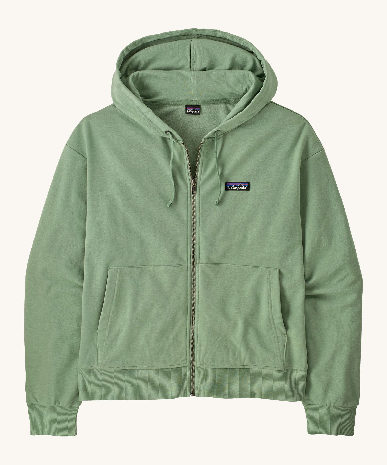 Patagonia women's Anhya hoody. A pastel green lightweight jacket available at Babipur. Features a full length zip, a logo patch stitched on the left chest, a easy access pockets and a drawstring around the hood for size adjustments.  