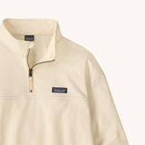 A close up of the Patagonia women's Anya pullover available at Babipur showing the 1/4 zip detail. Features a brand patch on the chest.