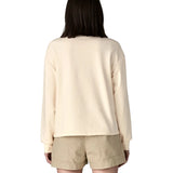 Back of woman wearing a cream Patagonia Women's Ahnya Pullover. Pullover has a relaxed fit