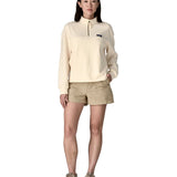 Woman wearing a cream Patagonia Women's Ahnya Pullover. Pullover has a relaxed fit and sits at the hips 